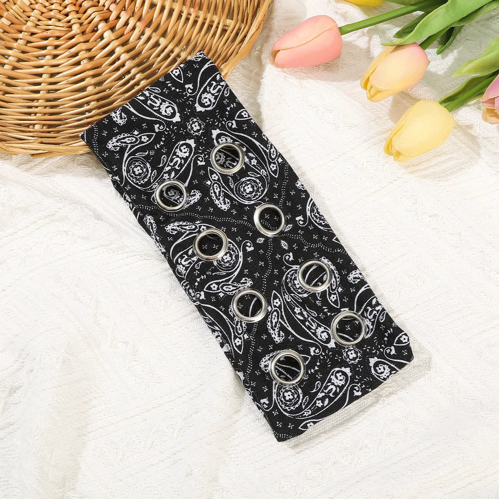 A black pullover hair band with a hollow metal circle on a model, showcasing punk hip hop style.