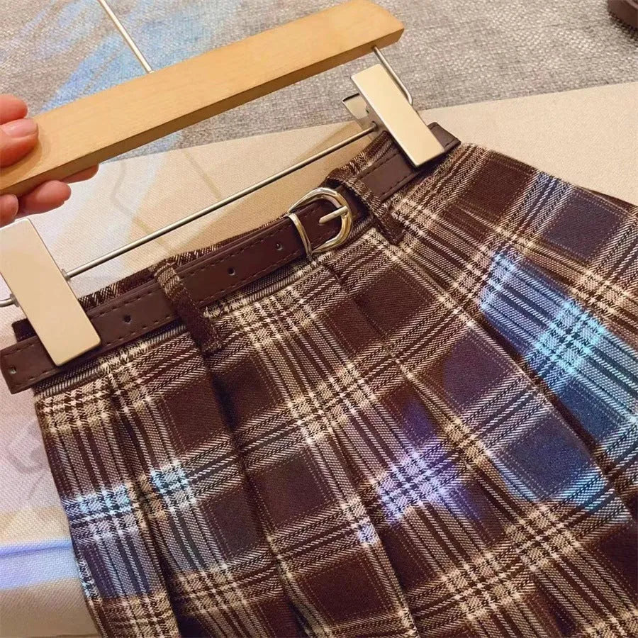 Children's cotton plaid pleated skirt with A-line silhouette shown on mannequin