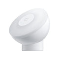 White Bluetooth induction bedside lamp with modern simple design on wooden nightstand