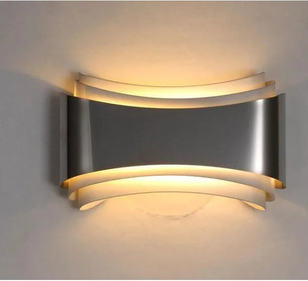 Modern white LED wall lamp with rectangular PMMA shade on a wall.