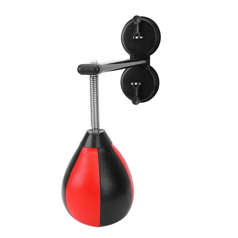 Red and black pear-shaped hanging boxing training ball with elastic cord and suction cup mount.