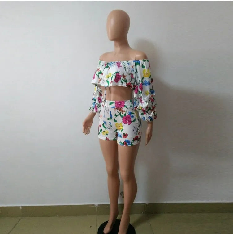 Women's multicolour printed tracksuit set with fleece sleeves on the top and matching shorts.