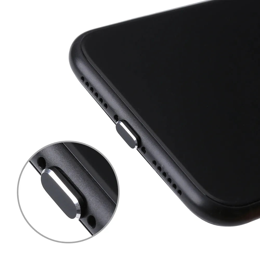 Aluminum alloy iPhone charging port dust plug in rose gold colour on a grey background.