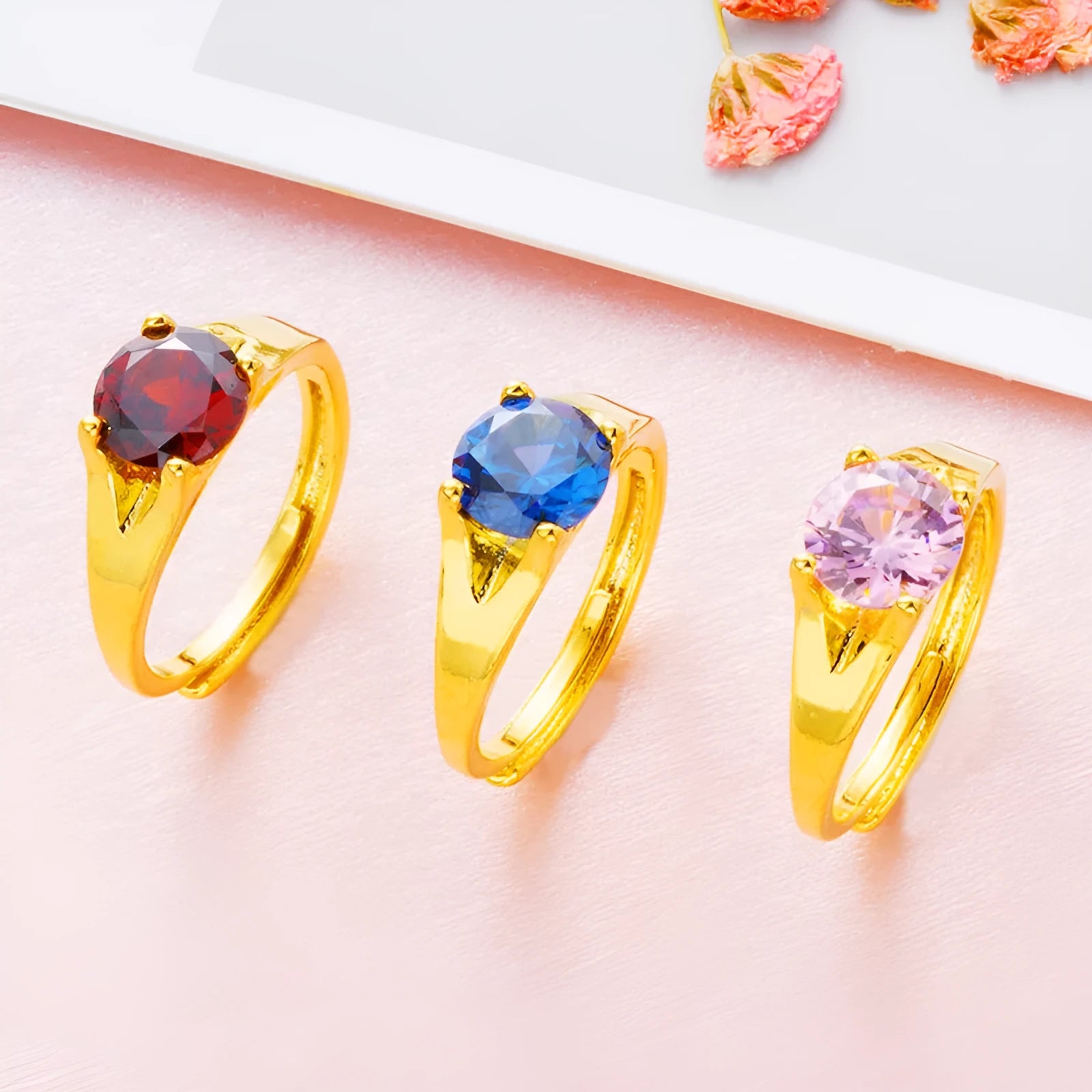 Women's adjustable copper ring with placer gold zircon stone, shown in multiple colour options.