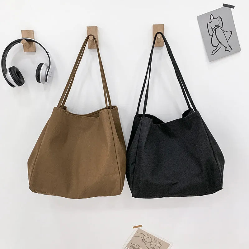 Solid colour women's canvas handbag with double shoulder straps and large shopping capacity