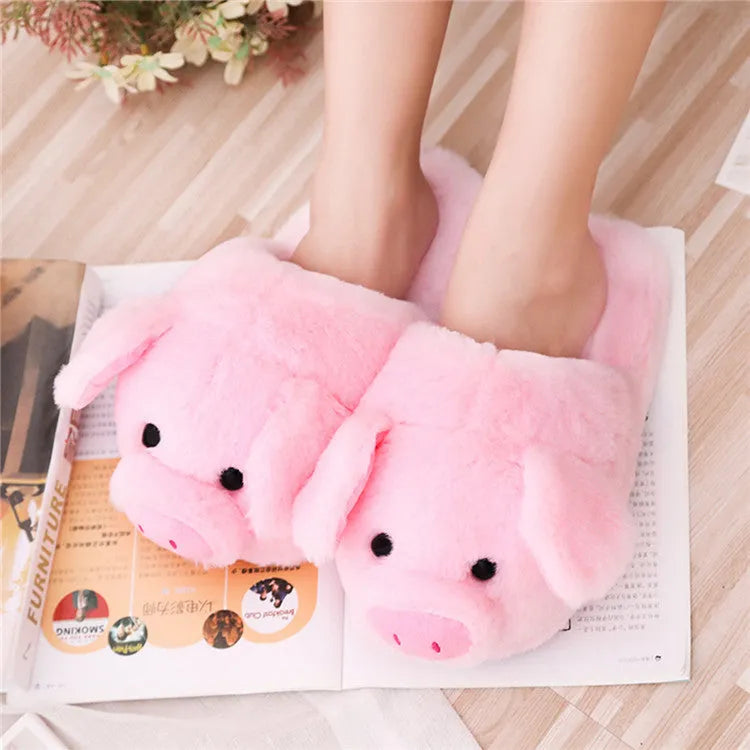 Pink pig-themed plush floor slippers for adults on a white background