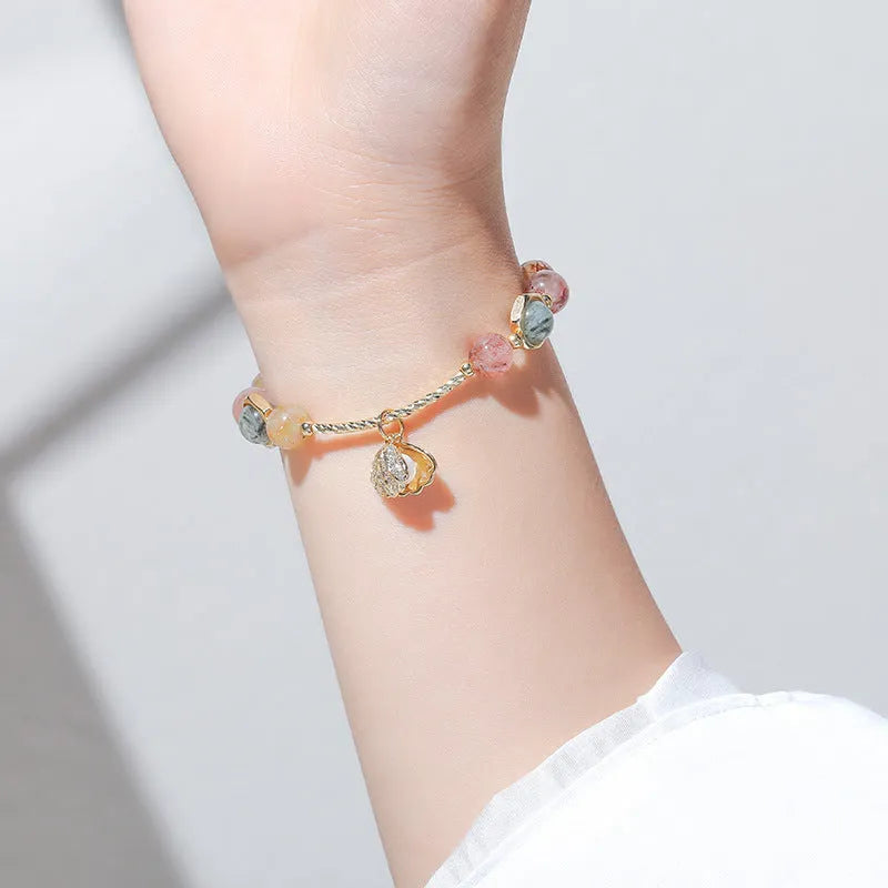 Colourful crystal bracelet with hair crystal shell and red sealant flower shell designs