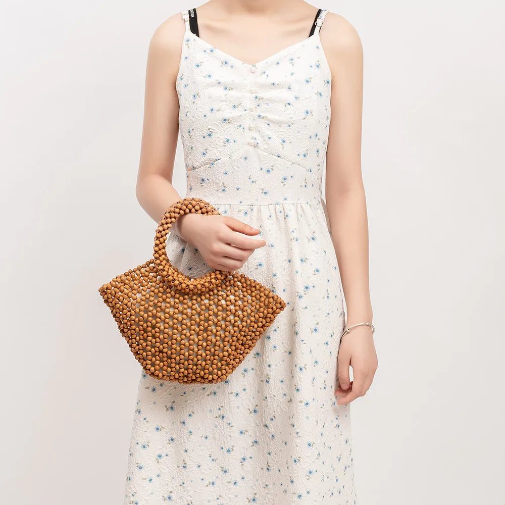 Maple wood hand-woven seaside handbag with wooden beads in dumpling shape