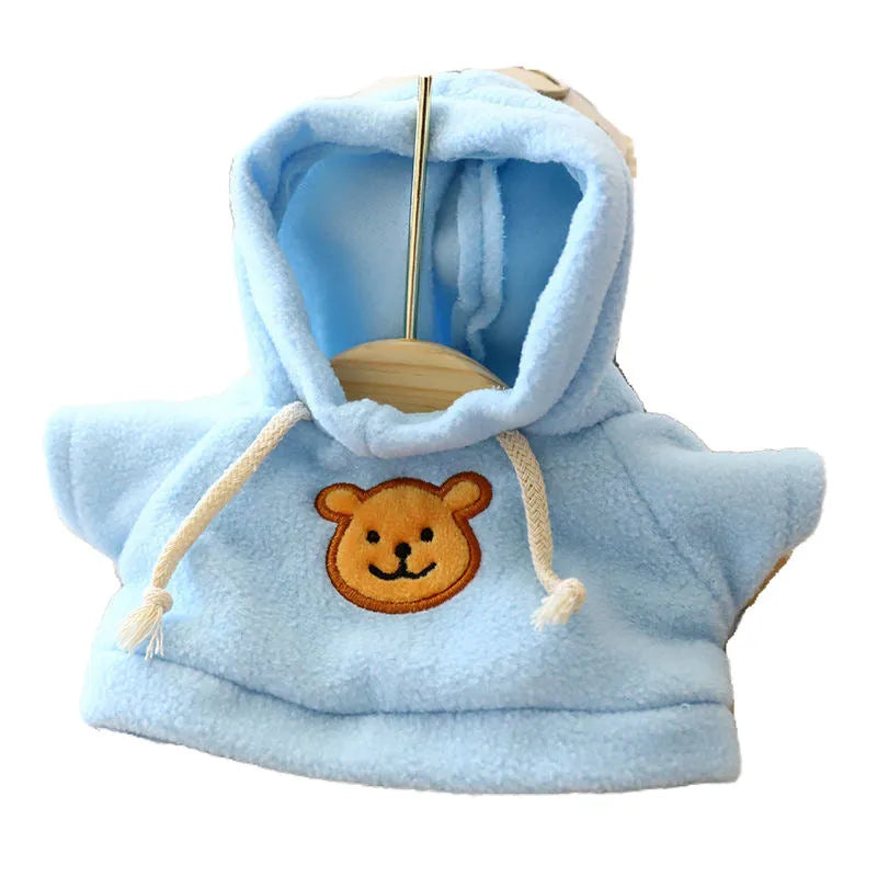 A dog wearing a soft cloth zip-up hoodie sweater in a choice of colours including a grey bear print.