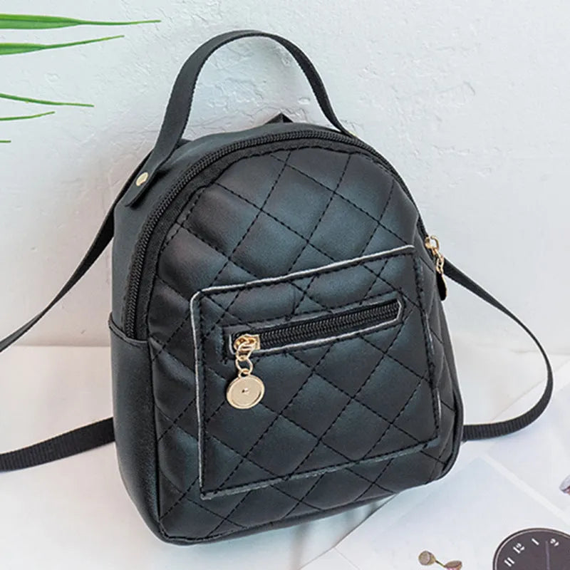 Hard square vertical girls' backpack in PU with embroidery, showing front sandwich pocket and soft carry handle.