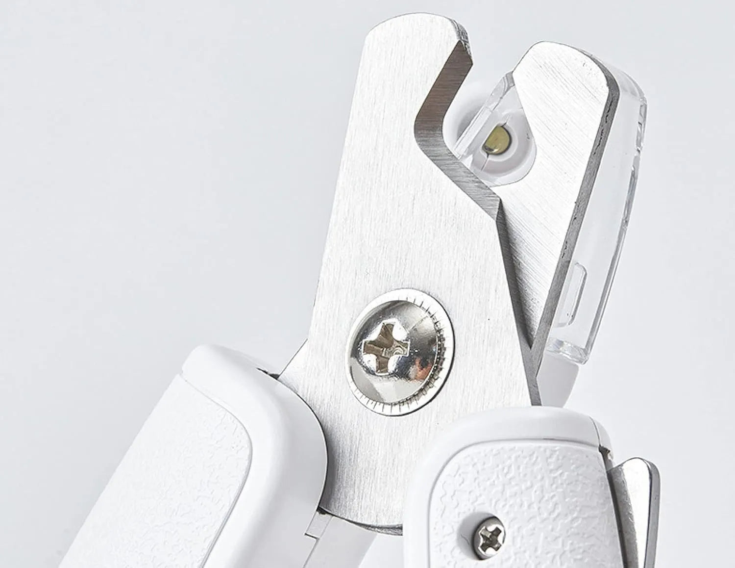 White LED pet nail clippers with a transparent guard open, showing the triangular blade and integrated nail file.