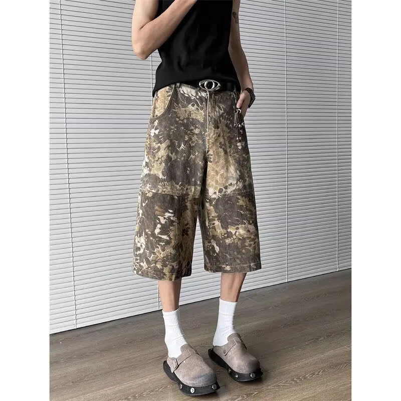 Yellow women's jeans with snake camouflage pattern and cropped leg length.