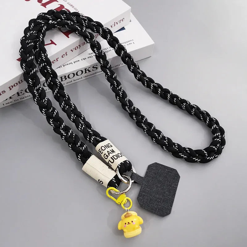 Woven nylon crossbody phone lanyard with macaron pendant in Pink Dot Gray, showing three-strand horse tail detail and matching clip.