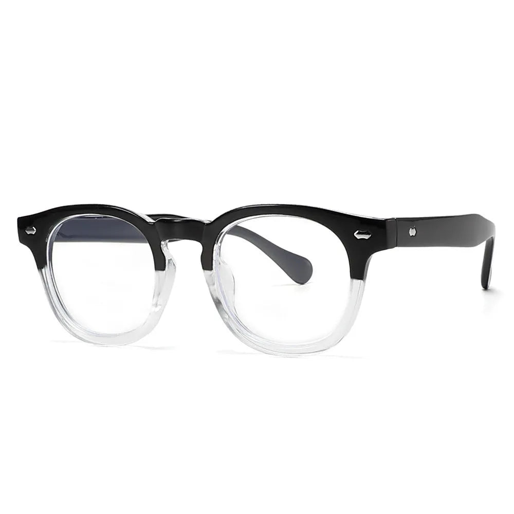 Round retro plastic sunglasses on a table, showing bright black frame with grey lens.
