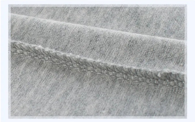 Grey children's cotton T-shirt shown with a size chart listing measurements from 90cm to 140cm.