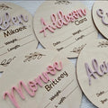Square plywood newborn name label showing baby birth information, 15cm wide.