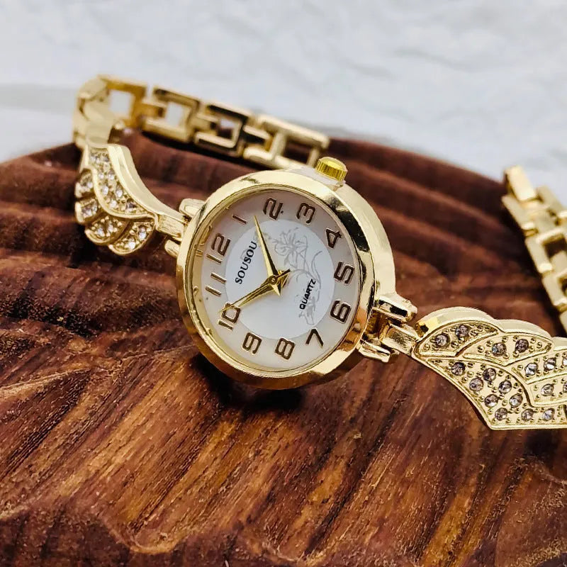 Stainless steel women's watch with round dial available in gold, white or black surface colours
