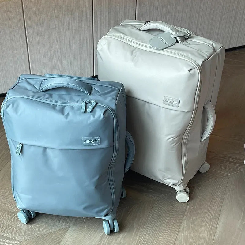 Waterproof Oxford cloth suitcase with universal wheels in six colour options including tea brown and haze blue