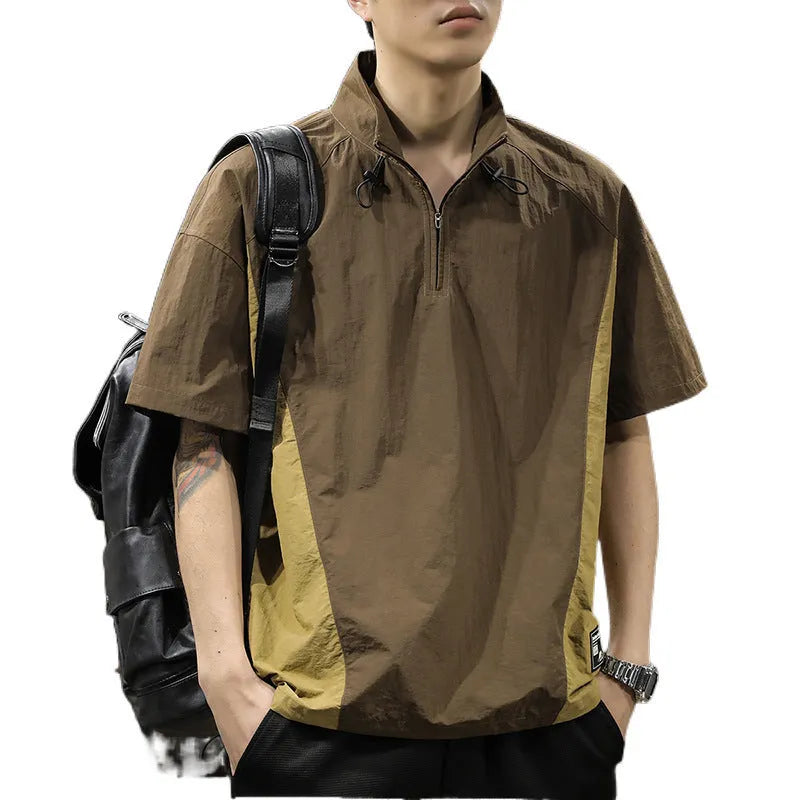 Man modelling a brown half-zip stand collar casual shirt with short sleeves.