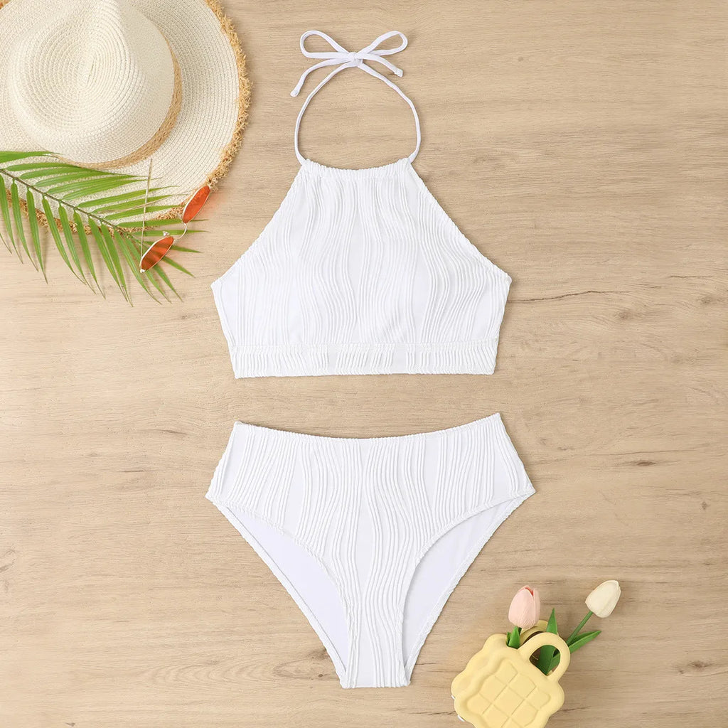Women's high-waist apron-style conservative two-piece swimsuit in a solid colour.