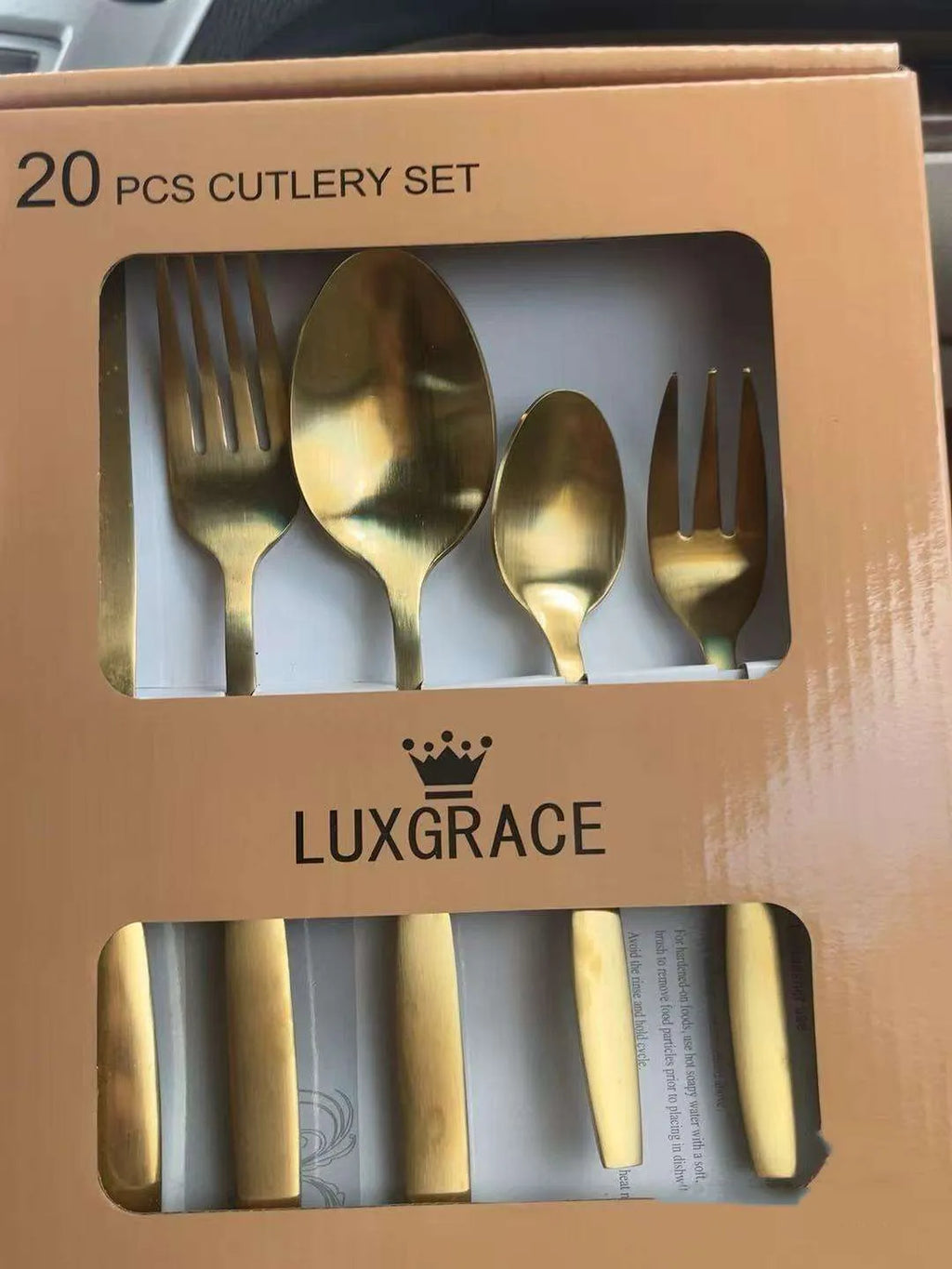 20-piece stainless steel cutlery set with mirror polished knives, forks and spoons on a table