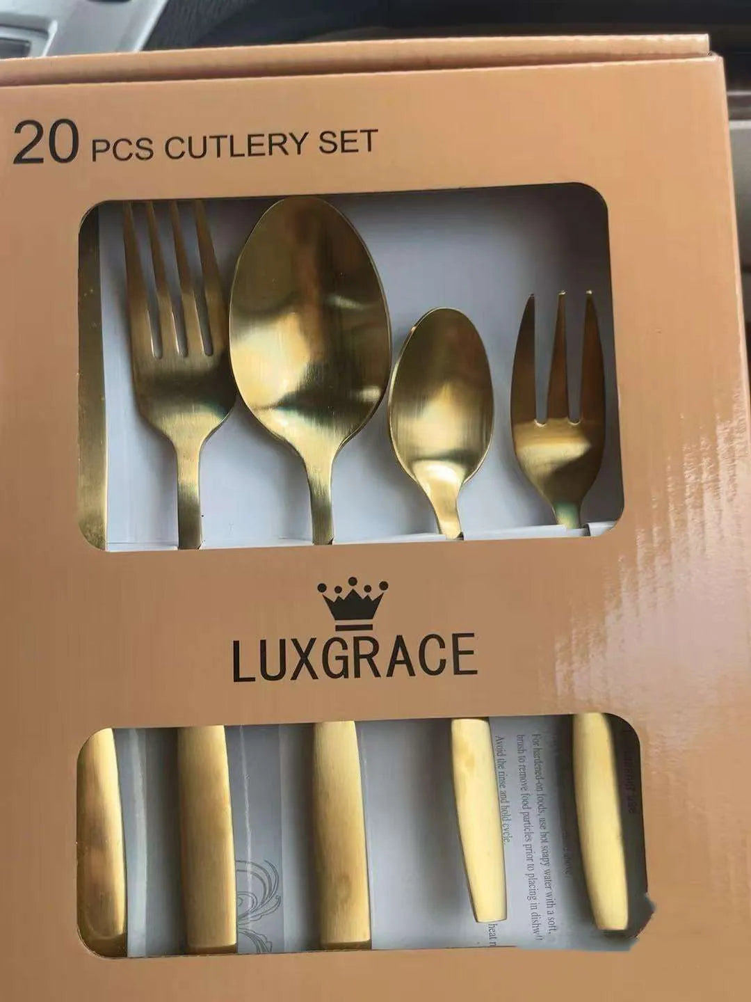 20-piece stainless steel cutlery set with mirror polished knives, forks and spoons on a table