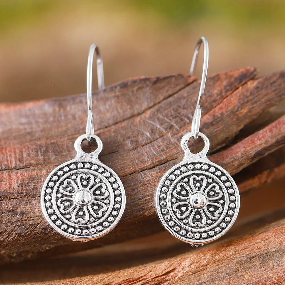 Bohemian retro distressed ethnic earrings with round geometric shape and circular prints