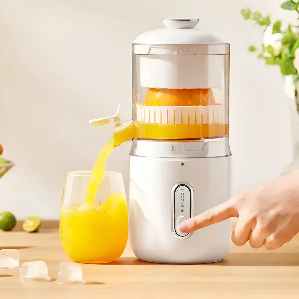 Fresh green portable USB electric juicer for oranges and lemons on a kitchen counter