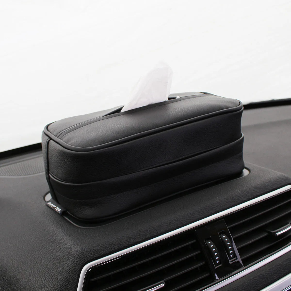 Black PU leather car hanging storage box with adjustable divider shown open.
