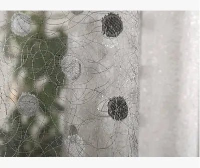 A single blackout curtain panel showing its polyurethane-backed fabric and one of the available hanging styles.