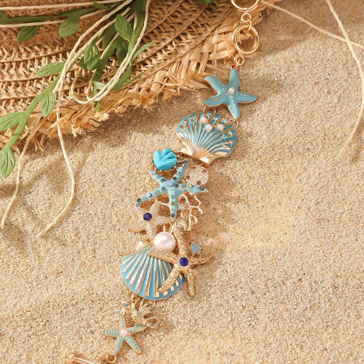 Alloy nautical bracelet with boat anchor charm, starfish detail, in turquoise, red, or blue.