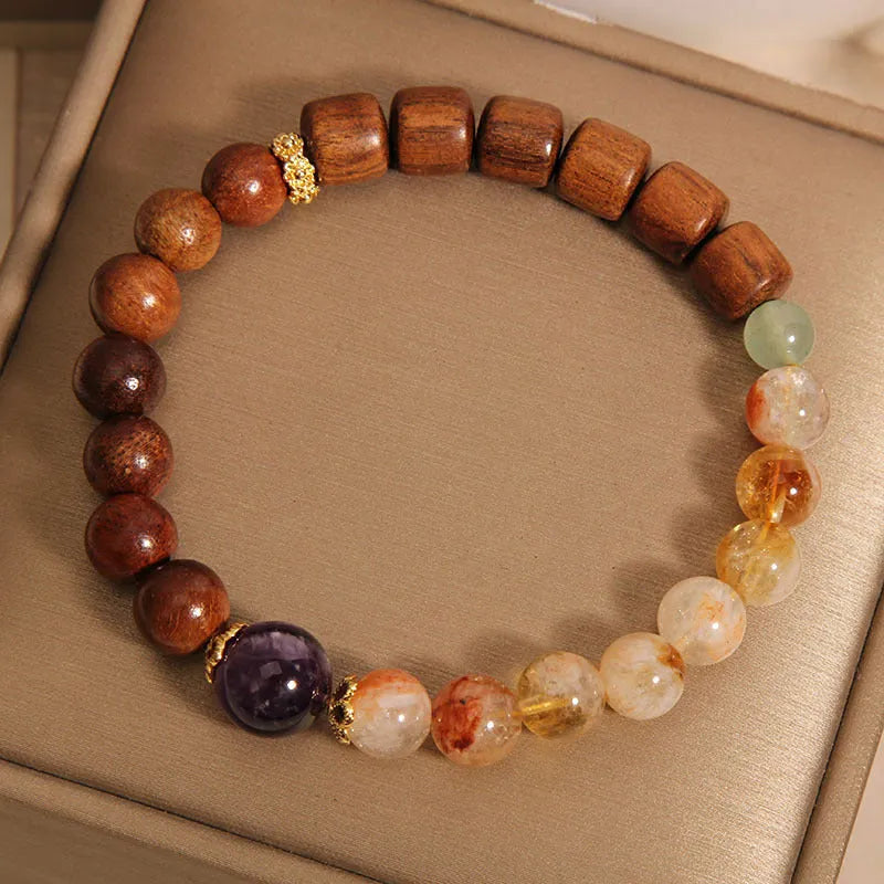 Women's bracelet with yellow tower crystal and amethyst beads, pearl and rhinestone accents