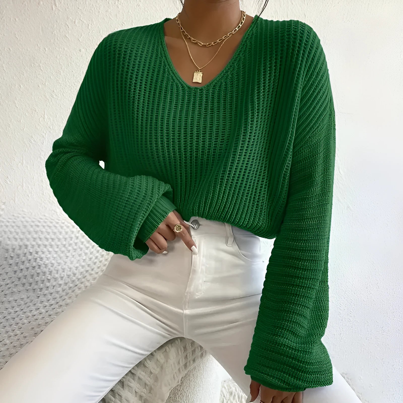 Women's solid colour long sleeve polyester pullover in a loose casual fit.