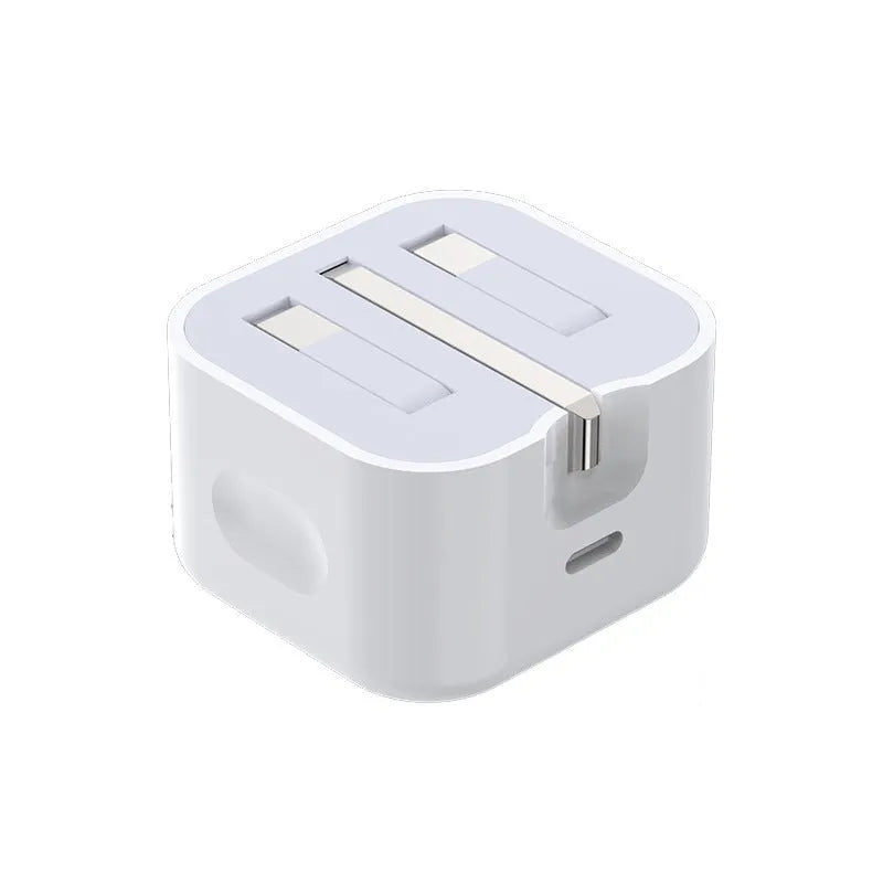 White 20W USB-C Power Delivery fast charger with British plug and coiled USB-C cable.