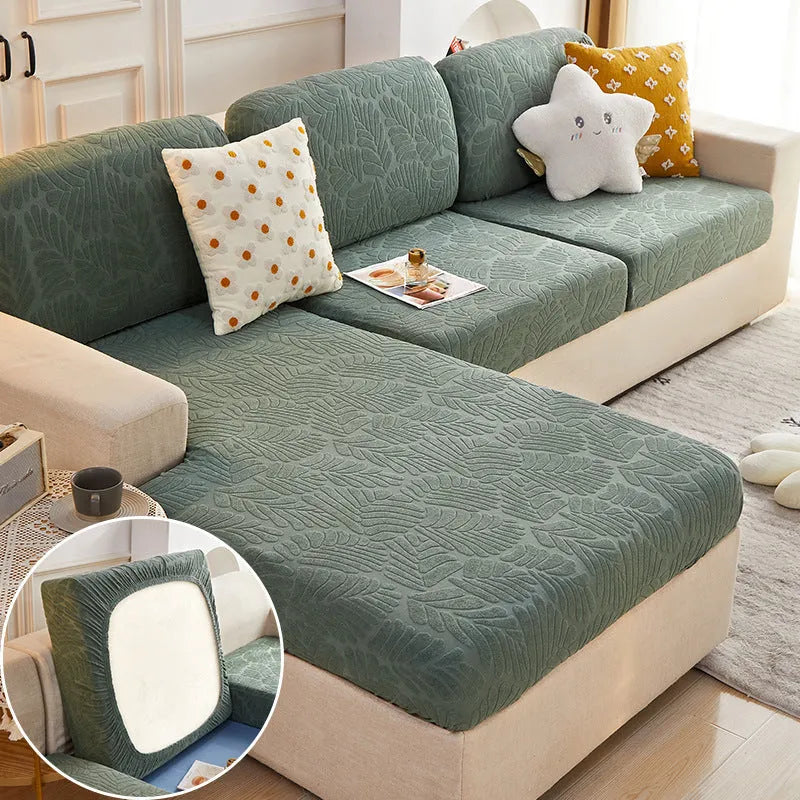 Nordic stretch sofa cover with Japanese banana leaf print in Lake Blue, fitted on a single cushion