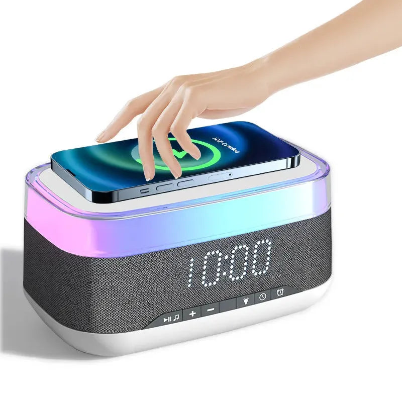 White multifunctional alarm clock with Bluetooth speaker and wireless charging pad