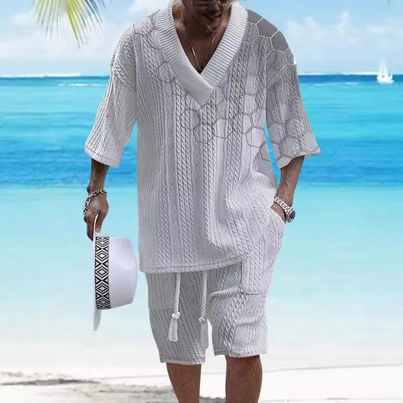 Men's grey knitted short-sleeved drop-shoulder top with matching shorts laid flat.