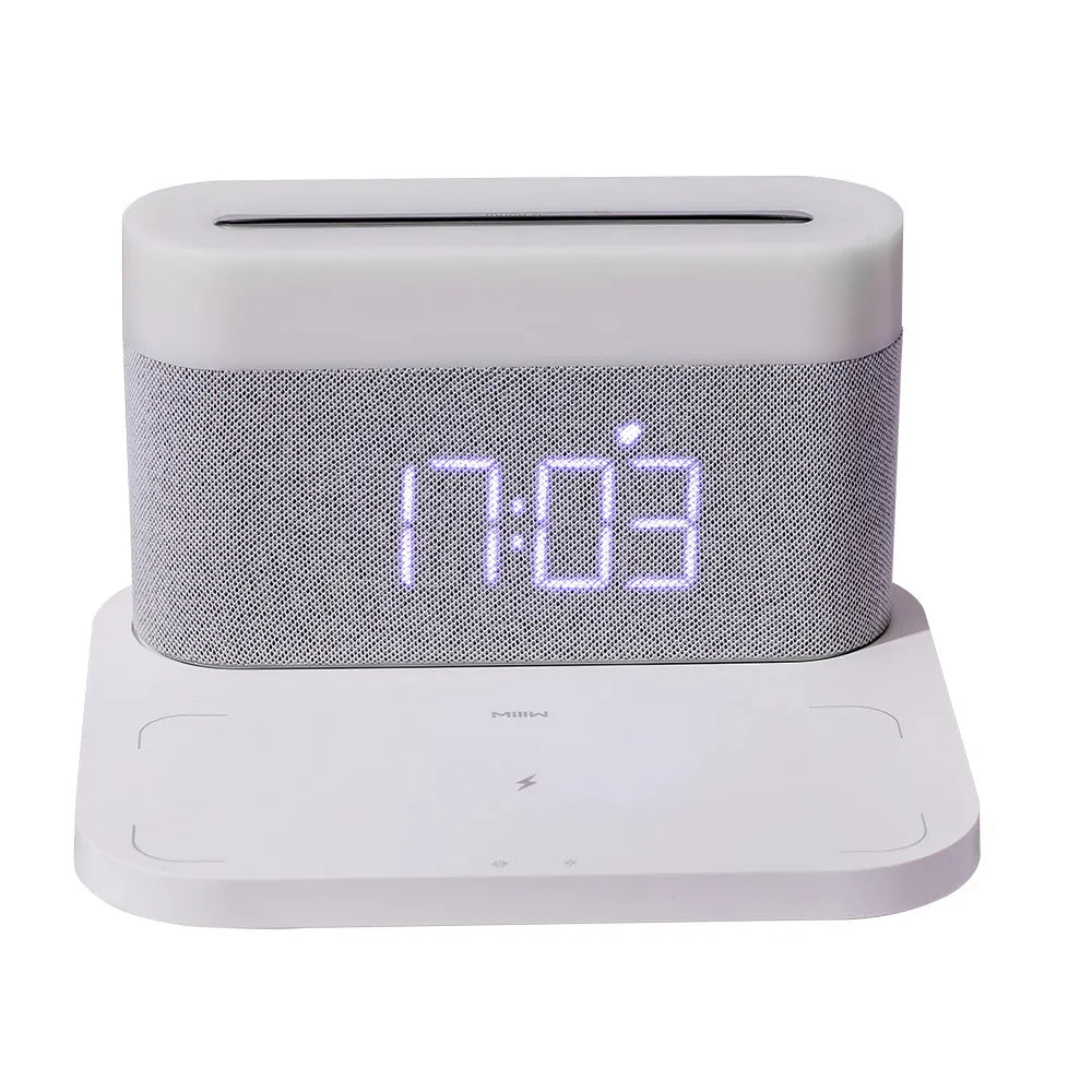 Black and white wireless desktop charger with clock display and ambient lighting functions