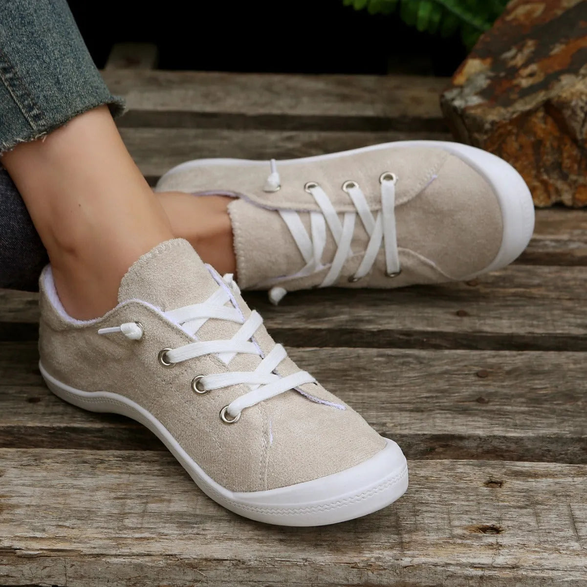 Women's creamy white fabric casual sneakers with low-top design and rubber sole