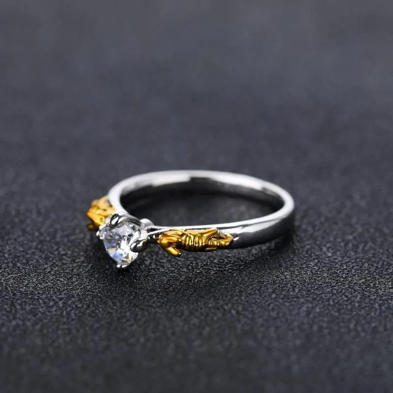 Black gold copper crown modelling ring for cosplay on a plain background.