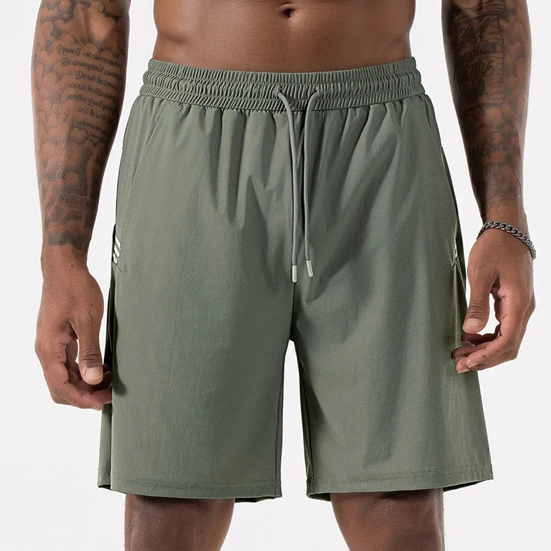 Man wearing black ice silk quick-drying sports shorts with drawstring waist.