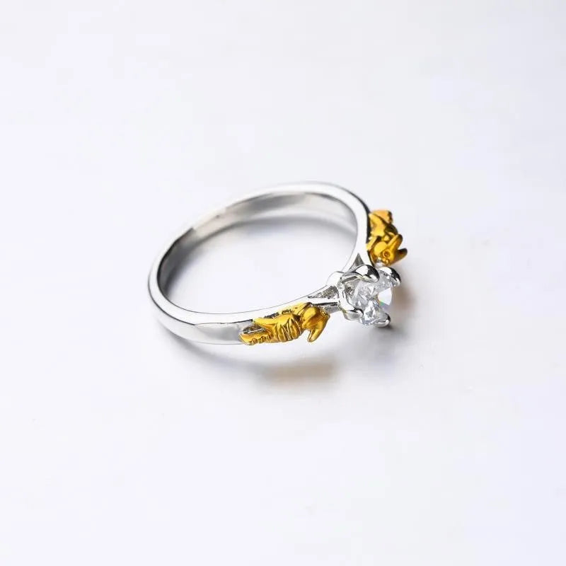 Black gold copper crown modelling ring for cosplay on a plain background.
