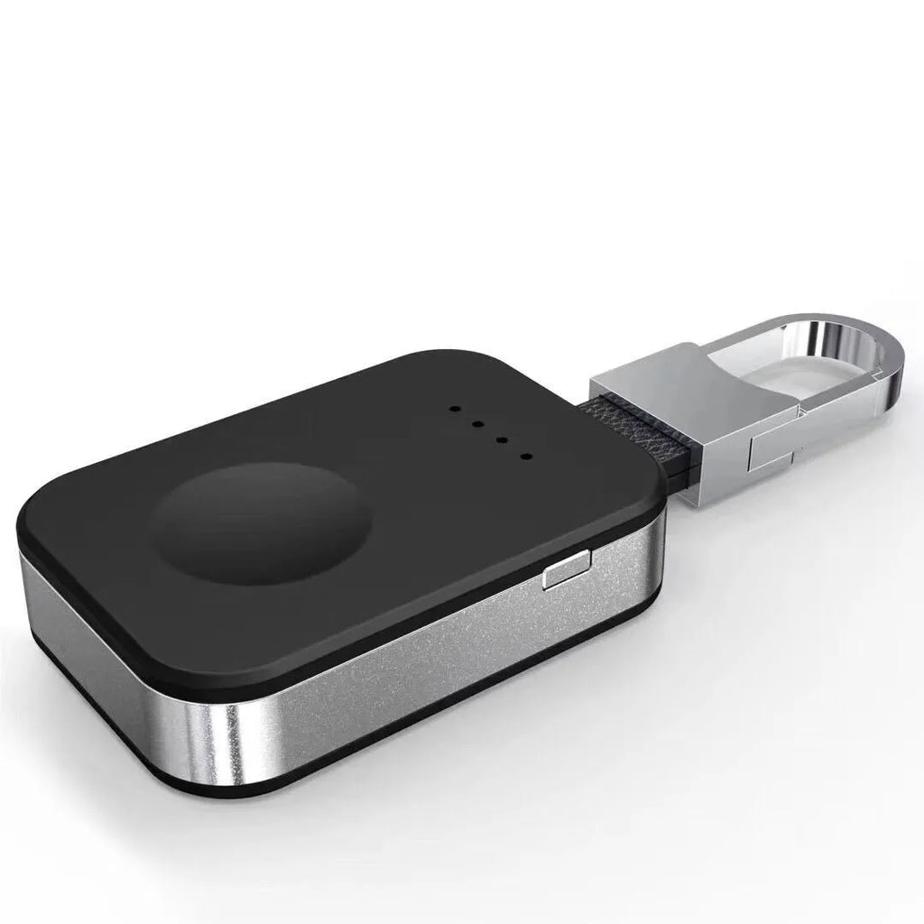 Black portable wireless power bank charger for Apple Watch on a keychain.