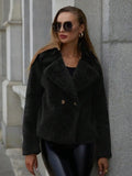 Women's loose short faux fur coat in rose red on a hanger, showing regular sleeves and textured fabric.