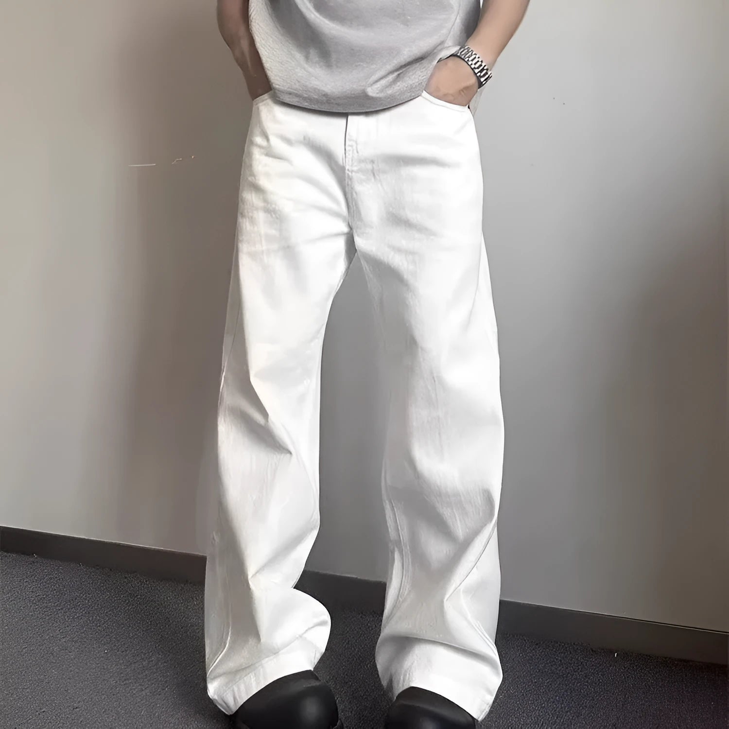Men's white straight wide-leg denim jeans on a mid waist, showing zipper fly and relaxed fit.