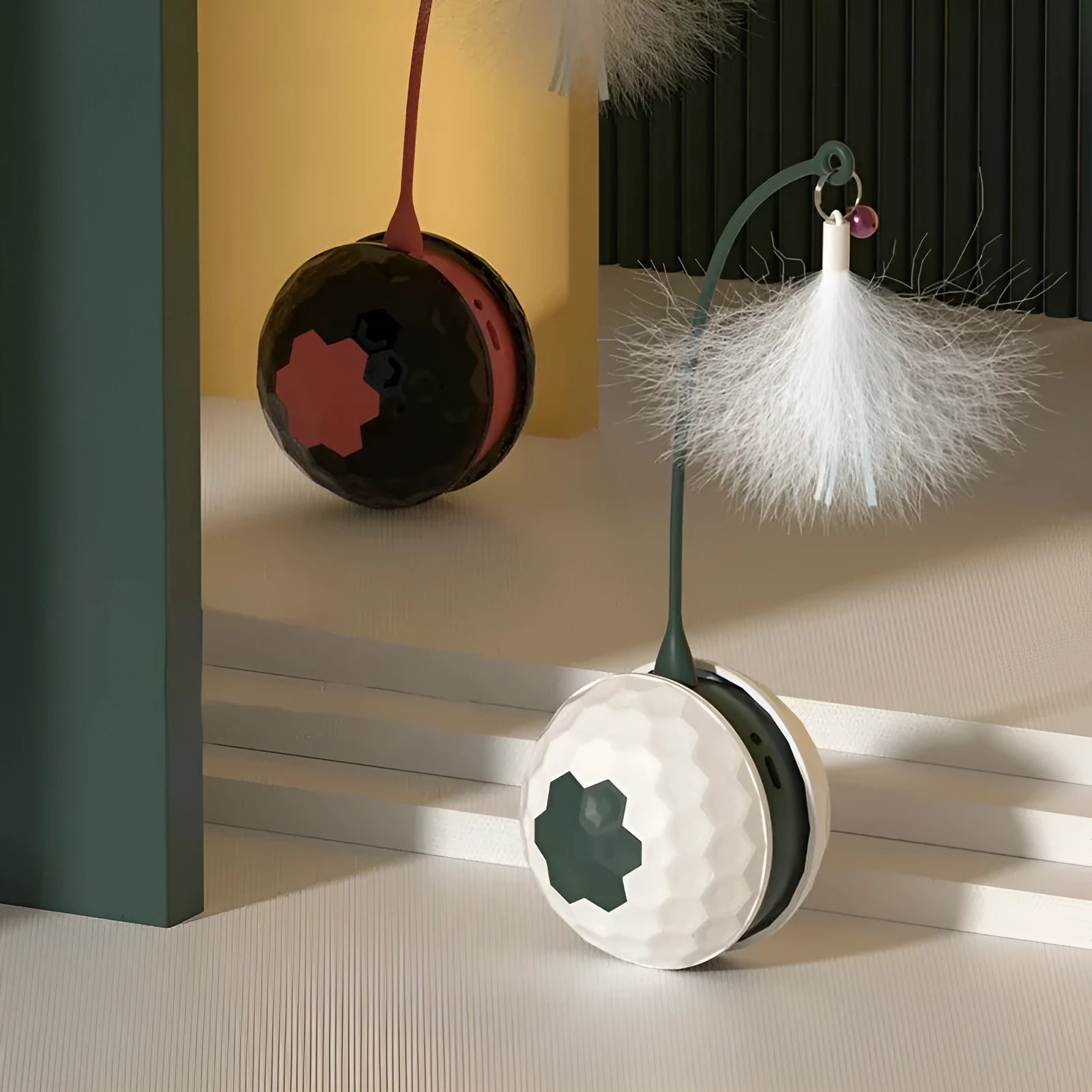 Self-moving cat teaser stick with feather and hemp rope attachments on a red base with USB charging cable