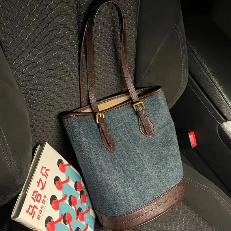 Denim patchwork bucket handbag with one shoulder strap showing retro styling
