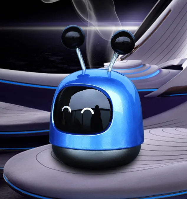 Robot-shaped car vent clip air freshener with aromatherapy gel in blue, grey, or red colour options.