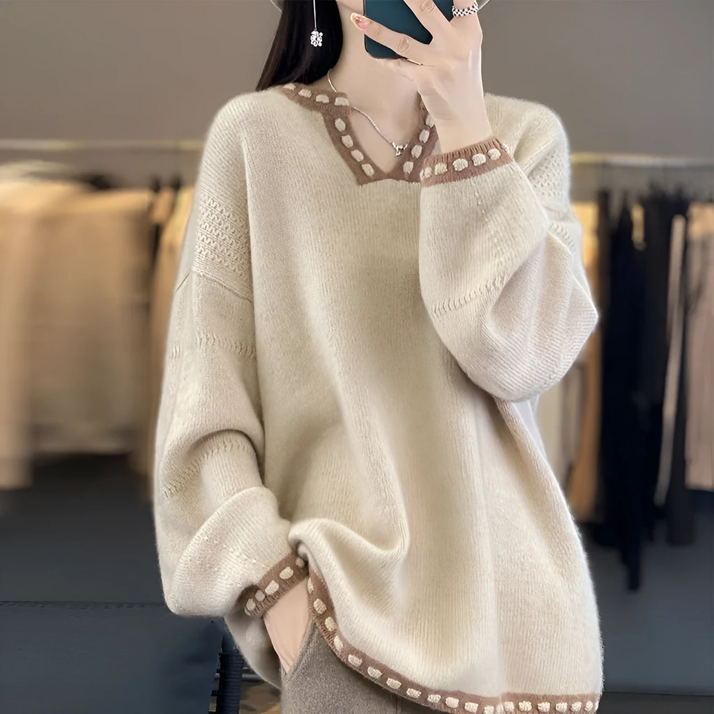 Women's camel coloured V-neck long sleeve pullover sweater made from viscose fibre fabric.