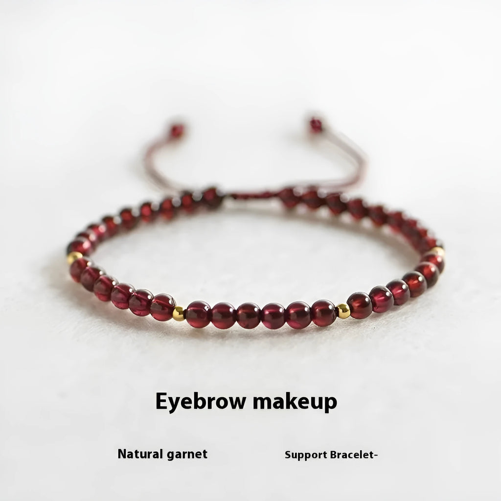 Hand-woven garnet red rope bracelet with flexible wire on a neutral background.